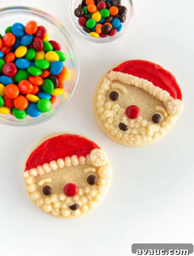 Easy Santa cookies with a red hat, white beard, and M&M face