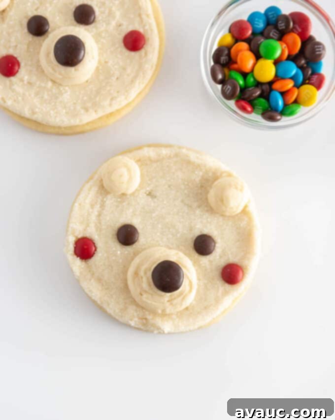 Cute and Simple Polar Bear Cookies 7 A collection of easy polar bear cookies, beautifully decorated with M&M candy, ready for a festive display.