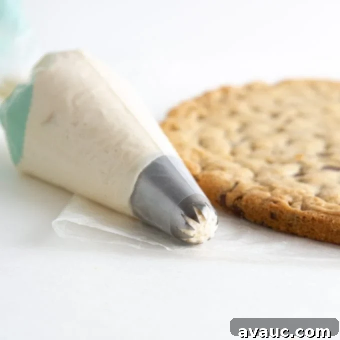 The Grand Birthday Cookie Cake 9 piping bag with vanilla buttercream and large star tip