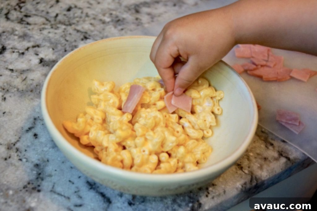 5 Smart Ways to Supercharge Boxed Mac and Cheese for Growing Kids 7 Boxed mac and cheese with chopped ham, ready for serving