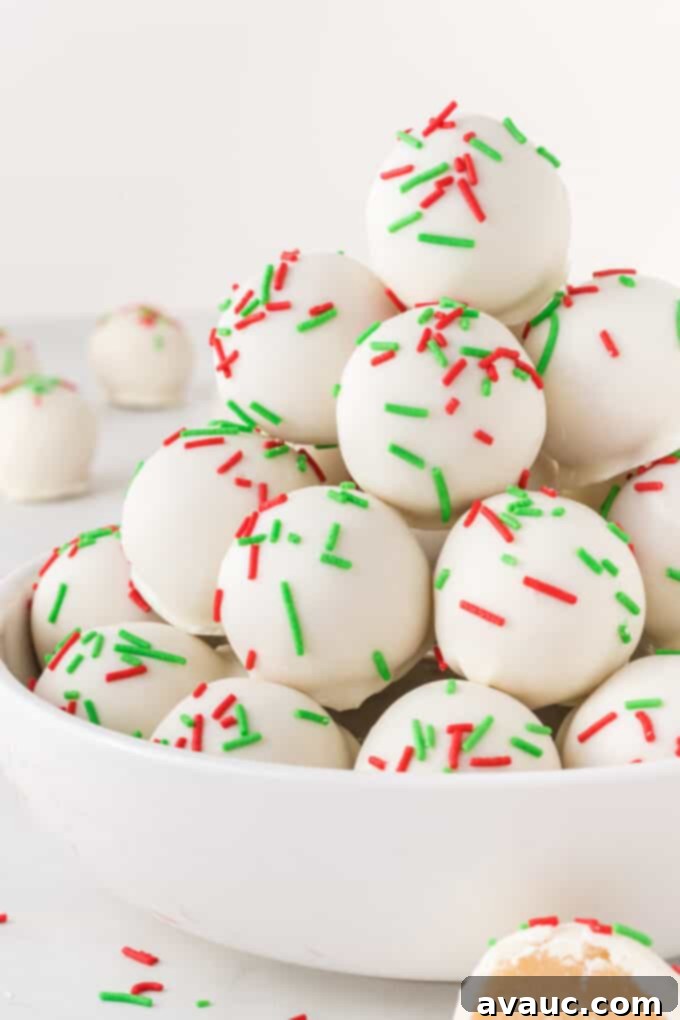 Gourmet Sugar Cookie Truffles 11 close-up of white chocolate sugar cookie truffles with vibrant red and green sprinkles