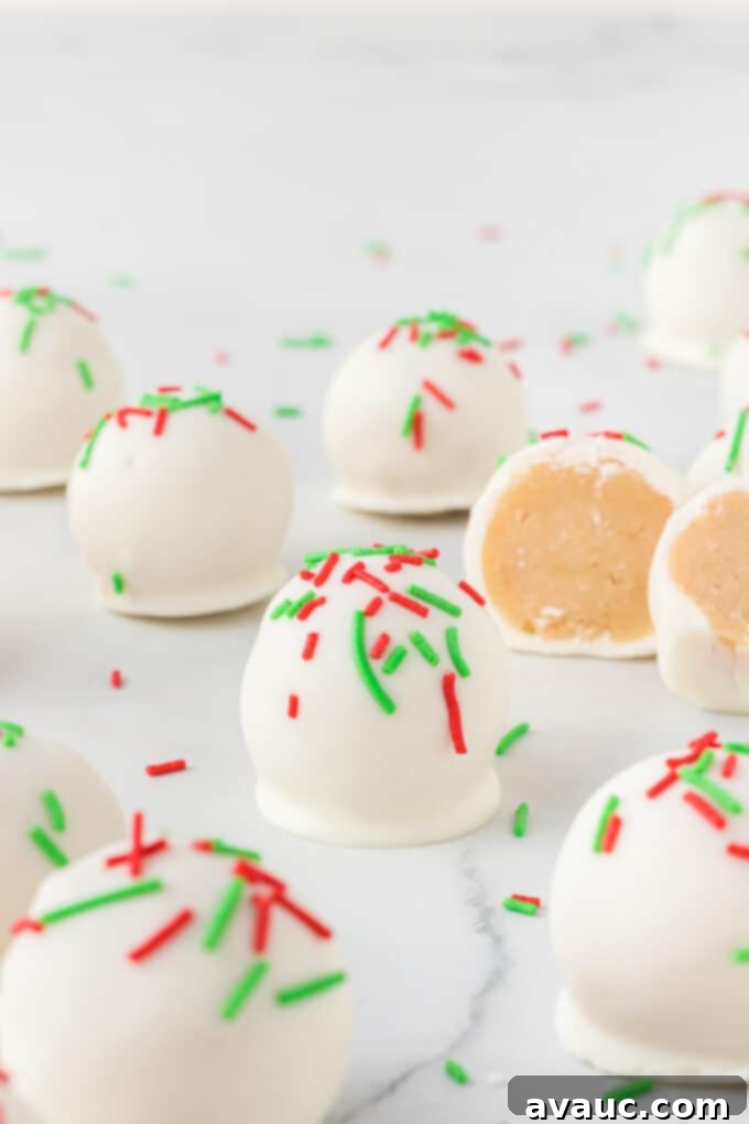 Gourmet Sugar Cookie Truffles 5 white chocolate sugar cookie truffles adorned with red and green sprinkles, arranged on a plate