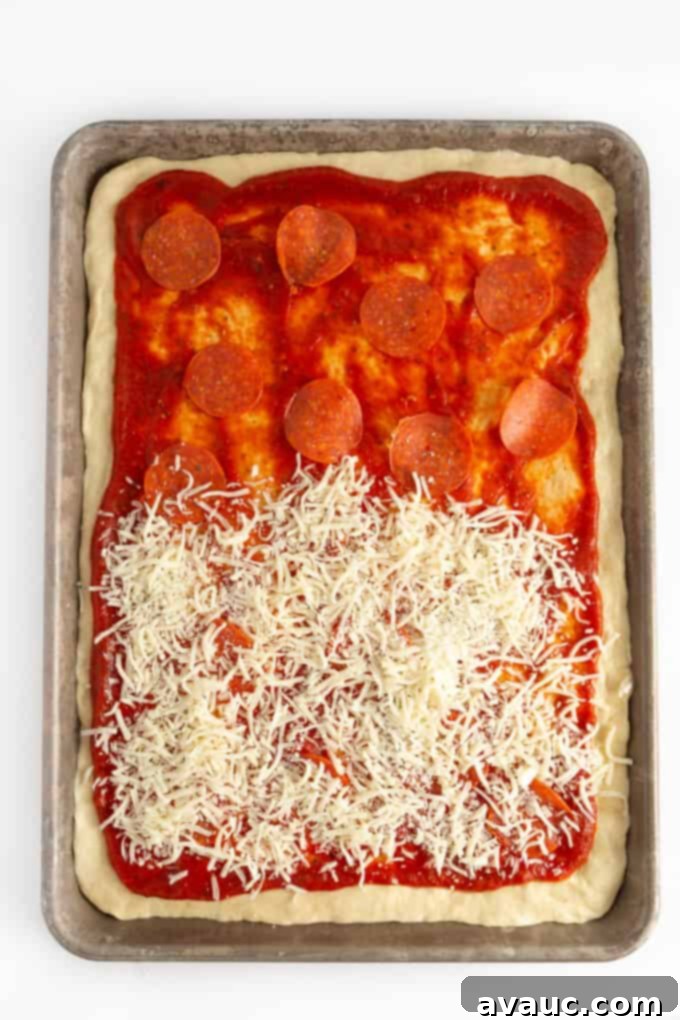 Pillowy One-Pan Pizza 9 sheet tray of pizza with sauce, pepperoni, and cheese