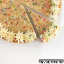 Vibrant Chewy Funfetti Cookie Cake 14 A beautifully decorated chewy funfetti cookie cake with sprinkles and frosting.