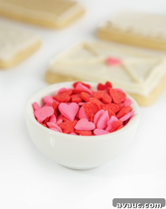 3 Quick Valentine Cookie Decorating Hacks 5 A pile of pink and red jumbo heart sprinkles for Valentine's Day cookie decoration.