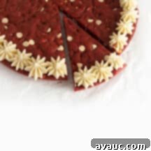 Decadent Red Velvet Cookie Cake 13 Red Velvet Cookie Cake with cream cheese frosting and white chocolate chips.