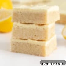 Lemon Sugar Cookie Bars with bright yellow frosting