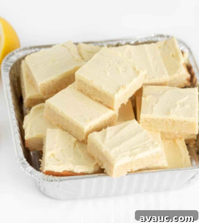 9x13 pan filled with freshly baked lemon sugar cookie bars, neatly cut into perfect squares.