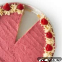Decadent White Chocolate Raspberry Cookie Cake 9 A close-up shot of the white chocolate raspberry cookie cake, highlighting the soft cookie texture and vibrant raspberry frosting.