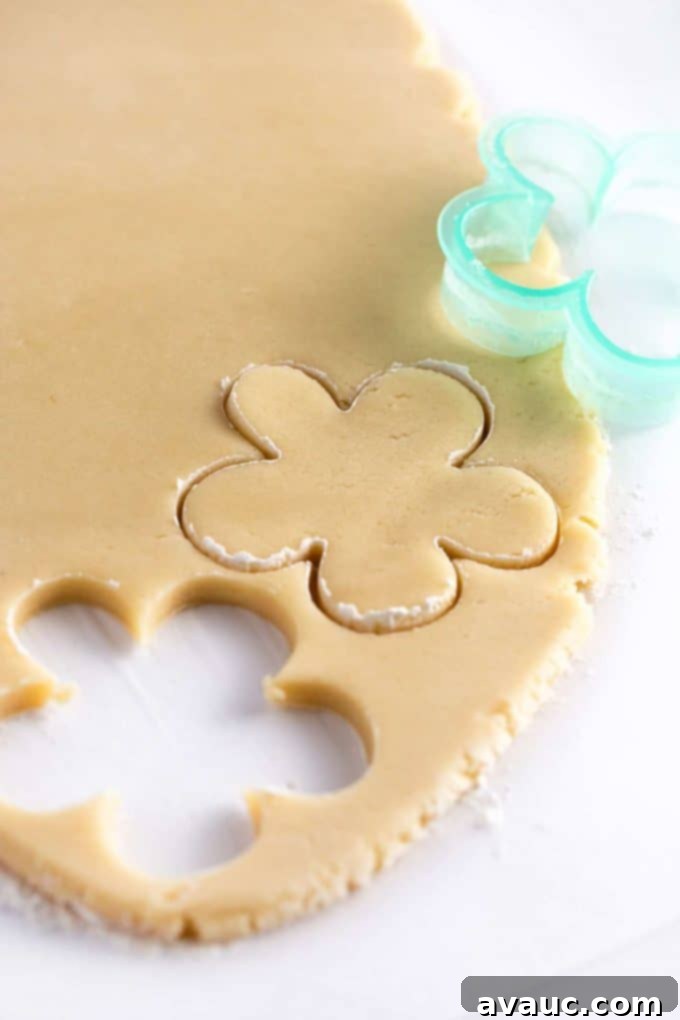 7 Delightful Easter Cookie Designs, Made Easy 4 Flower cookie cutter cutting sugar cookie dough
