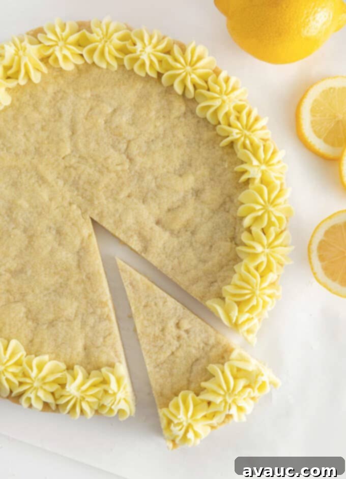 Zesty Lemon Cookie Cake 2 A beautifully decorated lemon cookie cake, sliced and ready to serve.