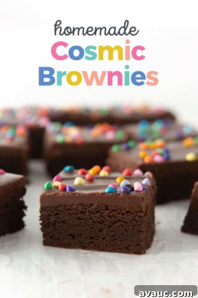 Thick, fudgy homemade cosmic brownies with chocolate ganache and rainbow sprinkles