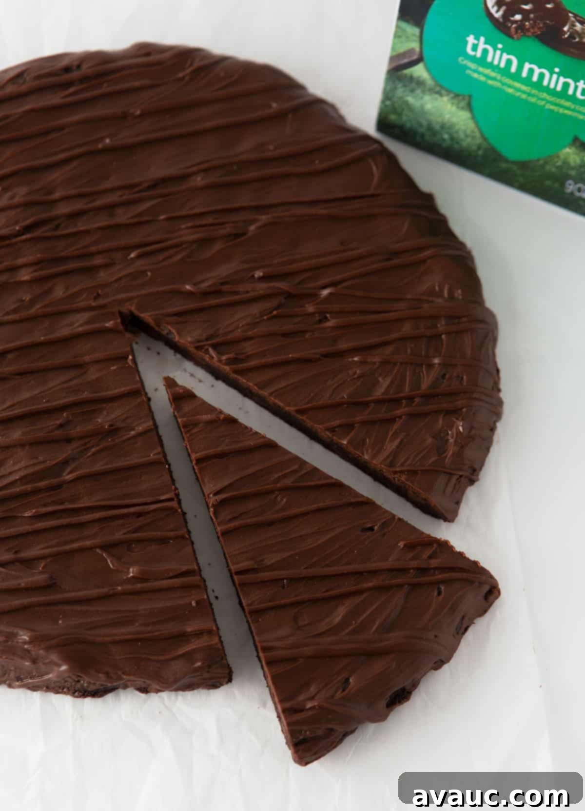 giant thin mint cookie cake, a large round mint chocolate cookie cake covered in chocolate ganache and drizzled with more chocolate