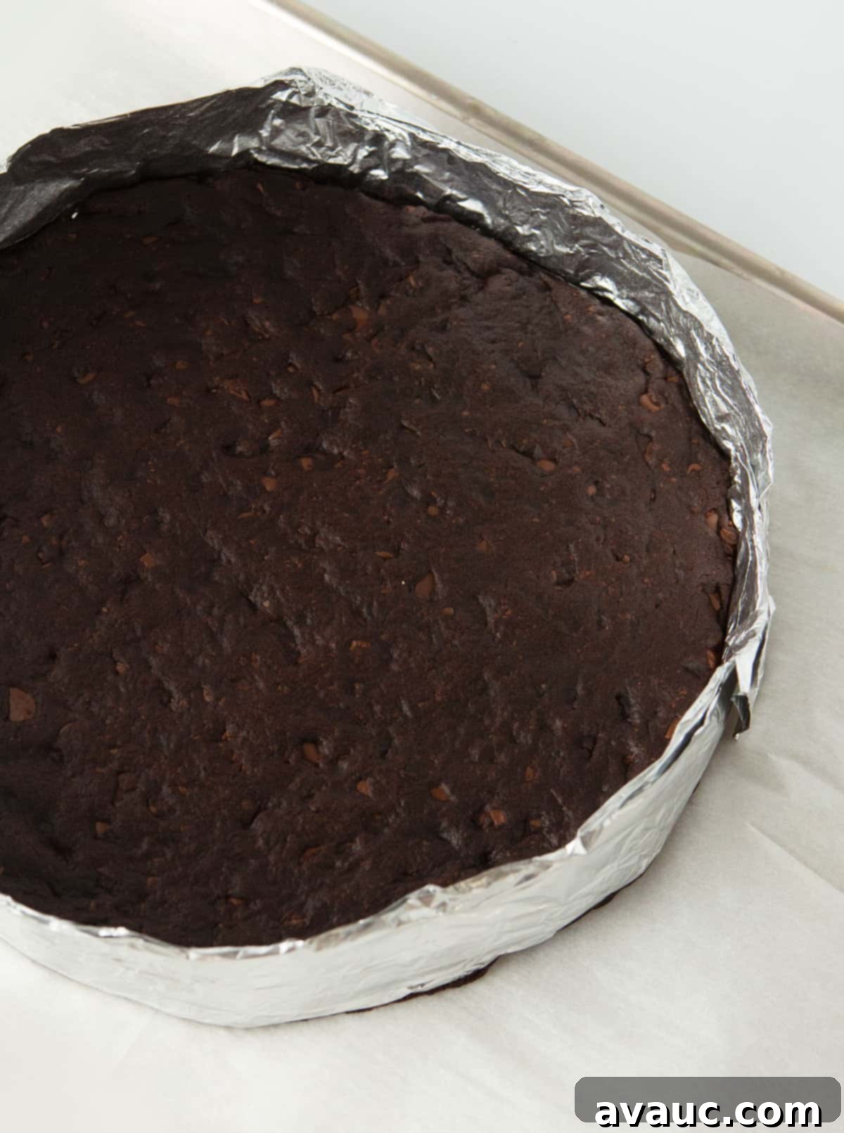 thin mint cookie cake baked in a DIY foil ring, golden brown around the edges and perfectly shaped