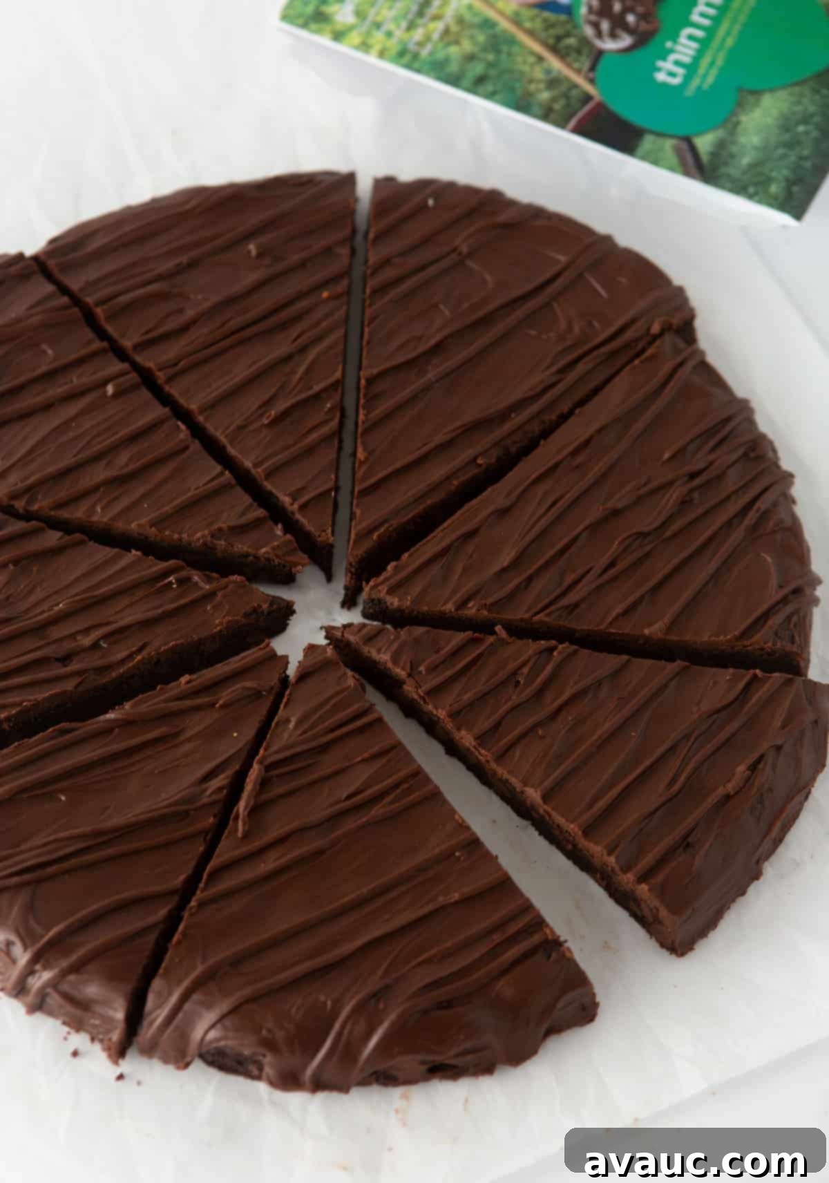 sliced thin mint cookie cake, revealing the perfectly portioned, rich mint chocolate pieces