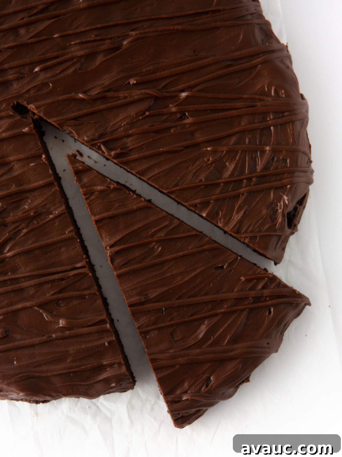 slice of thin mint cookie cake on a white plate, ready to be enjoyed