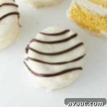 A beautifully crafted homemade Zebra Cake, showcasing its perfect layers and coating, ready to be enjoyed.