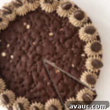 Oreo Dream Cake 10 Overhead view of decorated Oreo pizza cookie cake with one slice cut