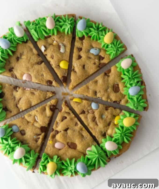 Beautifully decorated Easter cookie cake with green frosting and Cadbury eggs, ready for serving.