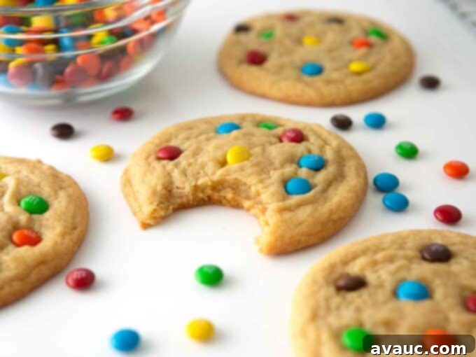 Mini M&M Chewy Bites 3 Close-up of a stack of soft, chewy mini M&M cookies, showing their vibrant colors and perfect texture.