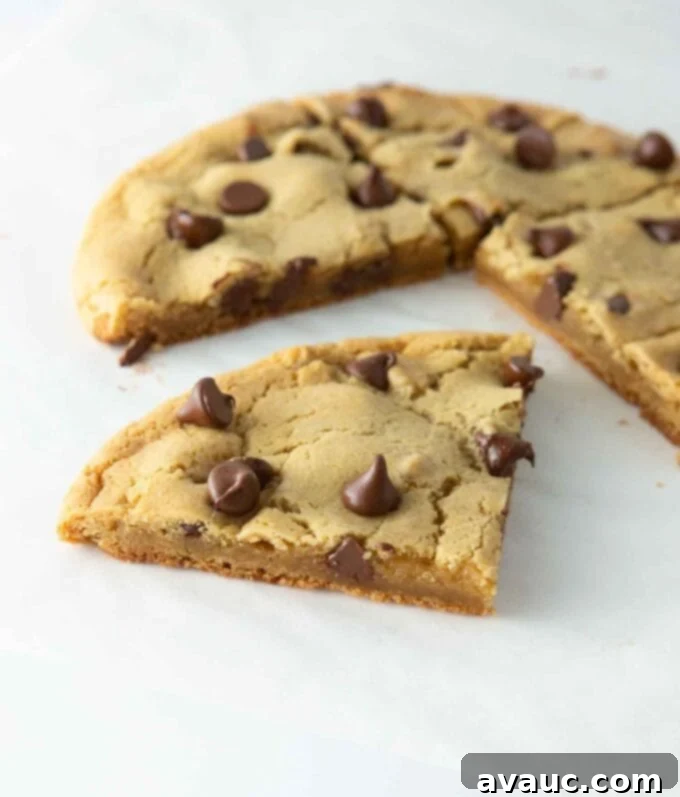 One Epic Chocolate Chip Cookie 4 Ingredients for a single giant chocolate chip cookie laid out on a marble surface.
