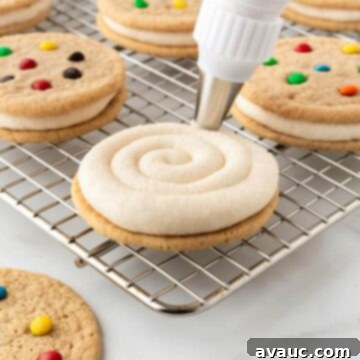 Piping frosting on cookie for cookie sandwich.
