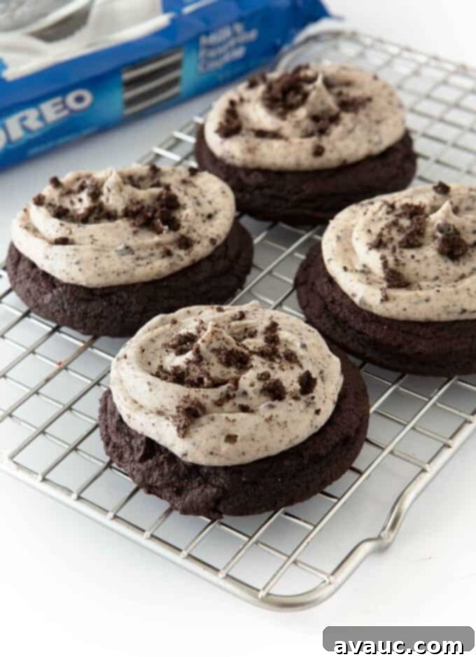 Irresistible Frosted Chocolate Oreo Delights 2 A stack of soft and thick frosted dark chocolate Oreo cookies with creamy frosting and crushed Oreos on top.
