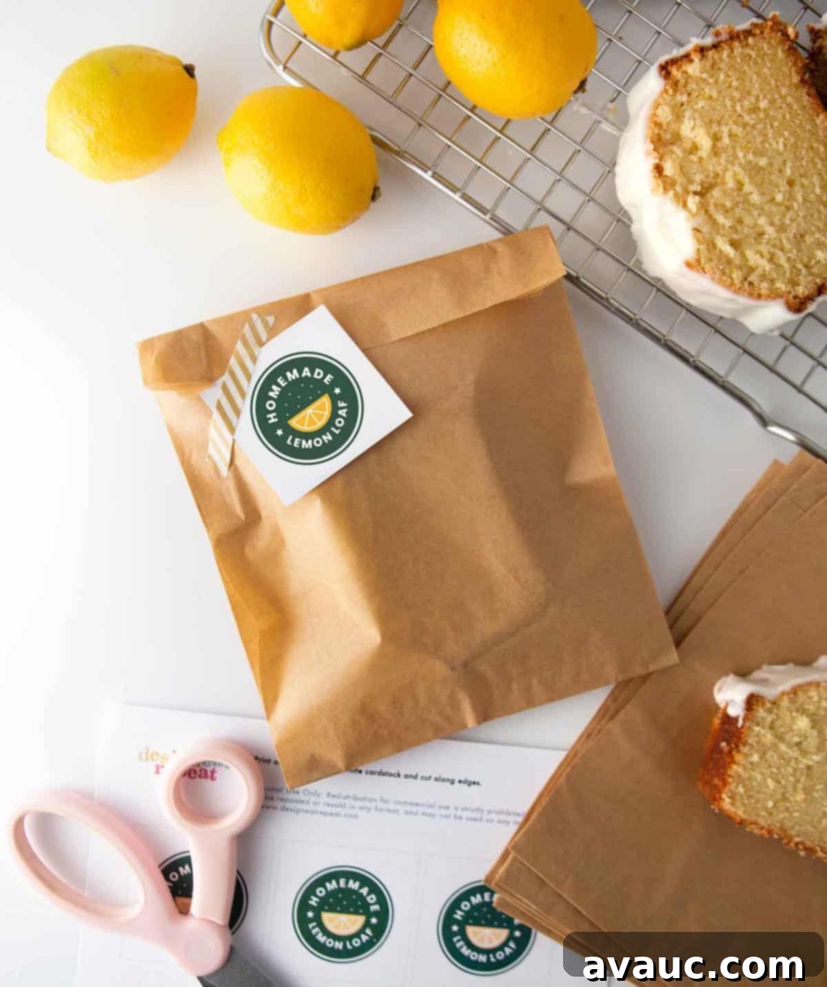 Starbucks-Inspired Lemon Loaf 3 Two freshly baked lemon loaves, one whole and one with a slice removed, showing off their golden crust and perfectly glazed tops.