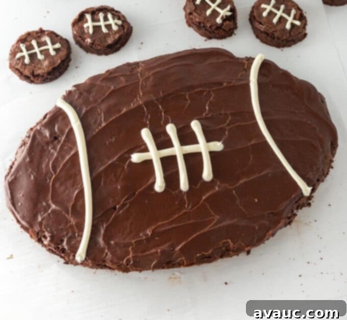 A plate with a square of brownie and a fork, showing the thick frosting.