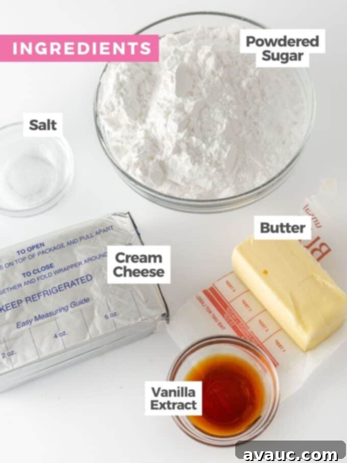 Ingredients for cream cheese frosting laid out, including butter, cream cheese, powdered sugar, and vanilla extract.