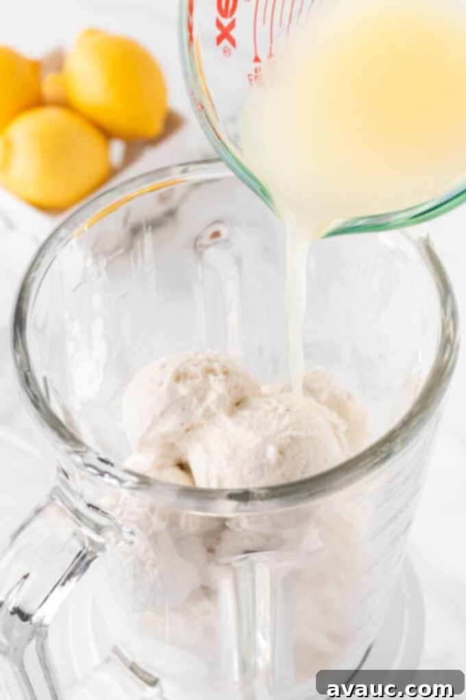 Homemade Chick-fil-A Frosted Lemonade 6 Pouring fresh lemon juice into a blender with ice cream.