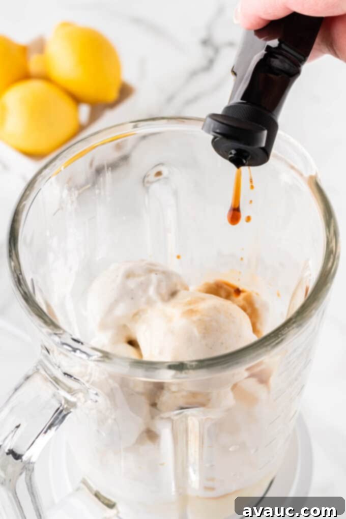 Homemade Chick-fil-A Frosted Lemonade 7 Adding vanilla extract to the blender for frosted lemonade.