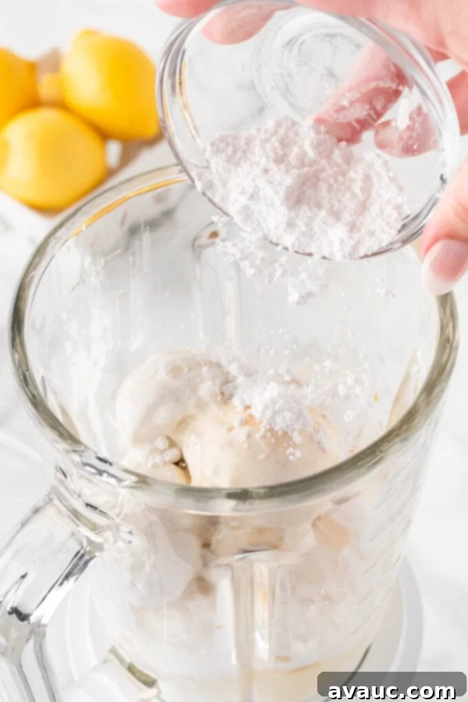 Homemade Chick-fil-A Frosted Lemonade 8 Adding powdered sugar to the blender to sweeten the frosted lemonade.