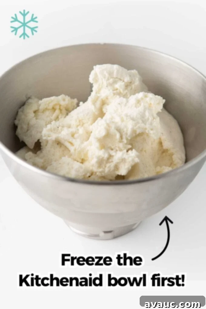 Vanilla ice cream in a KitchenAid mixing bowl, starting to soften.