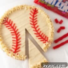 Homerun Hero Cookie Cake 8 Final decorated baseball cookie cake with white frosting and red stitches.