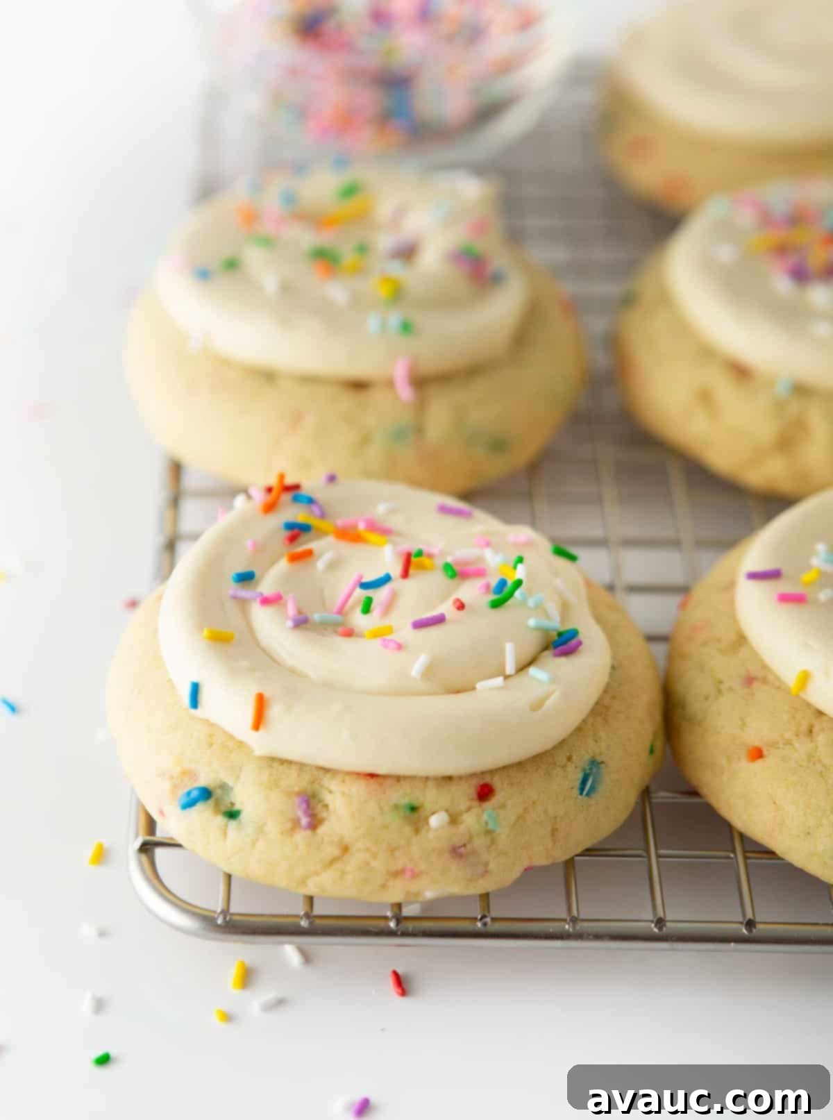 Frosted Funfetti Cookies 2 birthday cake cookies on metal cooking rack
