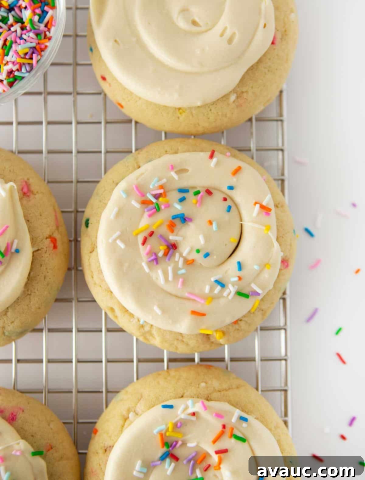 Frosted Funfetti Cookies 9 birthday cake cookies with frosting and sprinkles on wire cooling rack