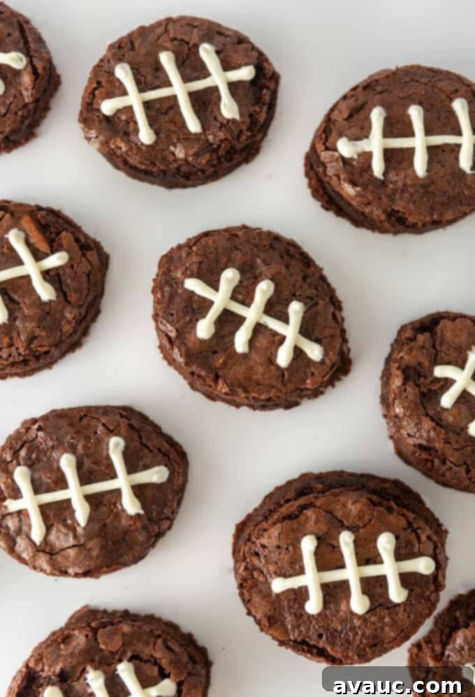 Touchdown Mini Brownies 3 close-up of fudgy mini football brownies with perfectly piped white frosting laces