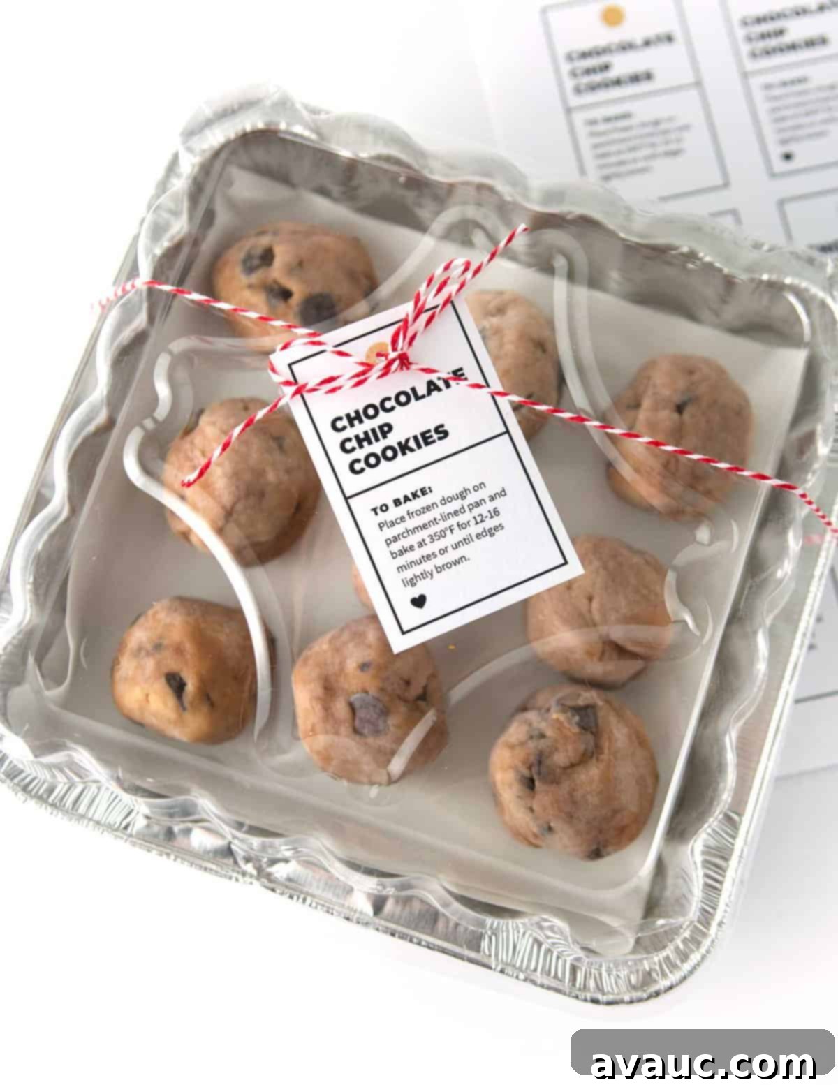 One Bowl Chocolate Chip Bliss 11 Two hands holding a plate of chocolate chip cookies, ready to be gifted.