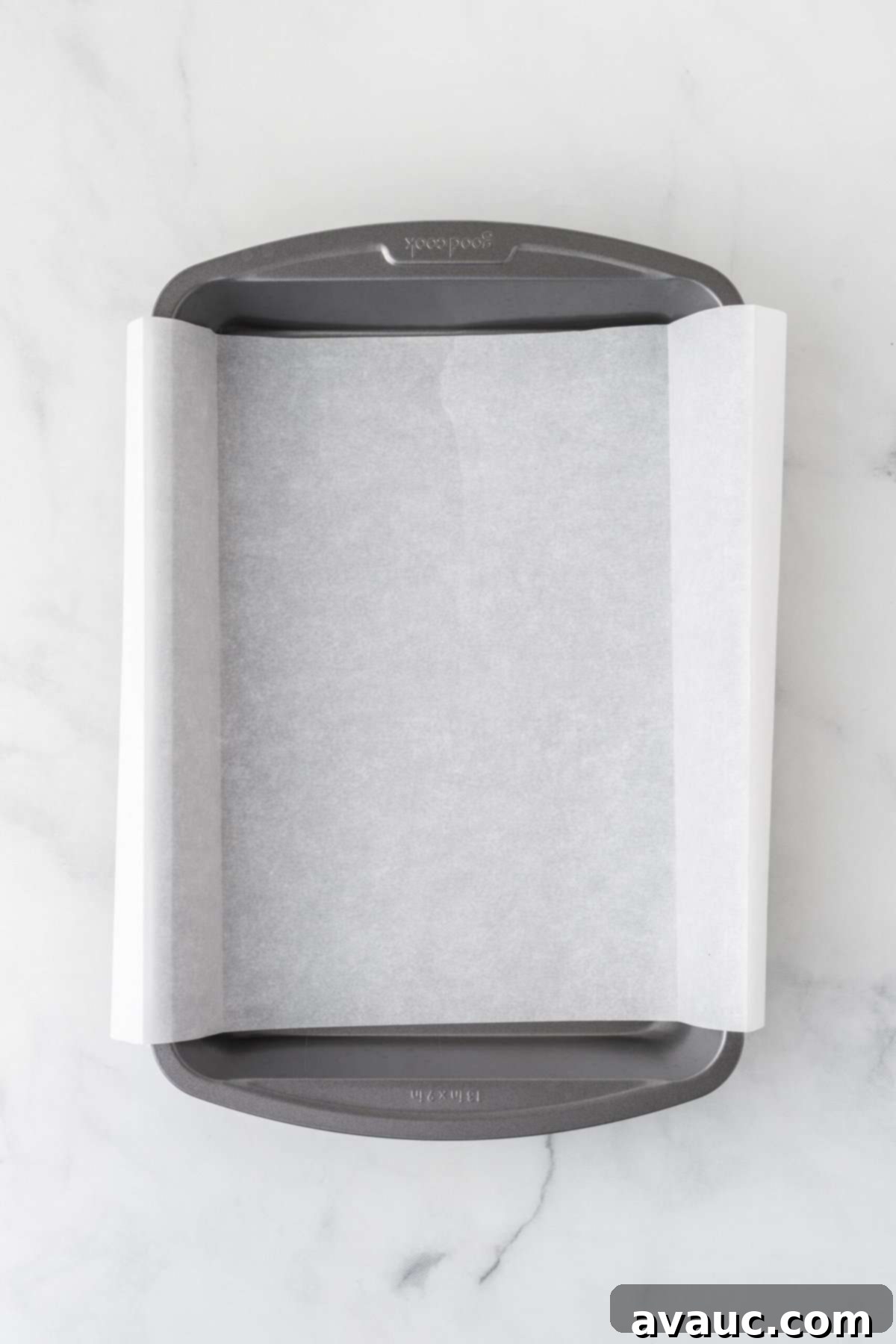 Dreamy Ice Cream Sandwich Cake 5 Parchment-lined 9x13 baking pan ready for assembly