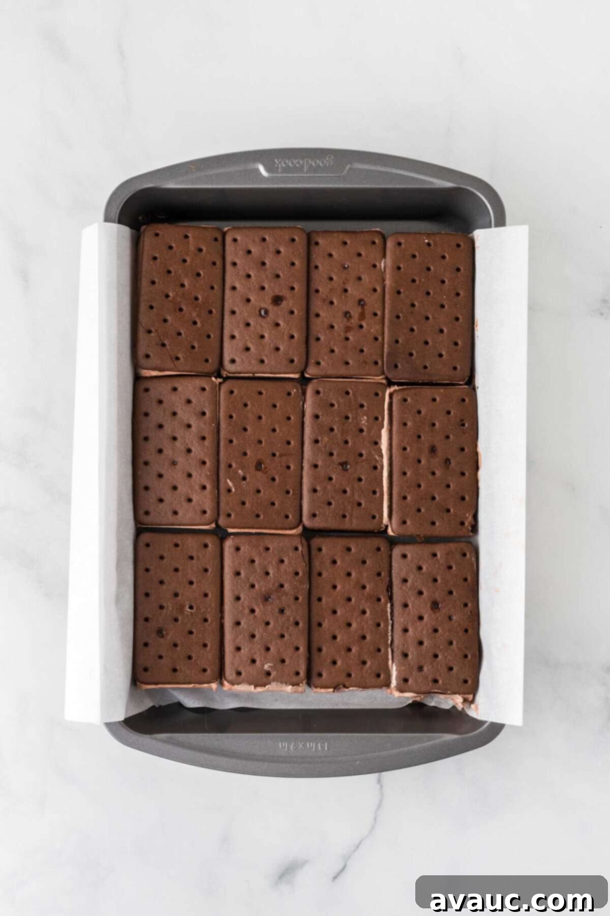 Dreamy Ice Cream Sandwich Cake 6 Layer of chocolate ice cream sandwiches neatly arranged in a 9x13 pan