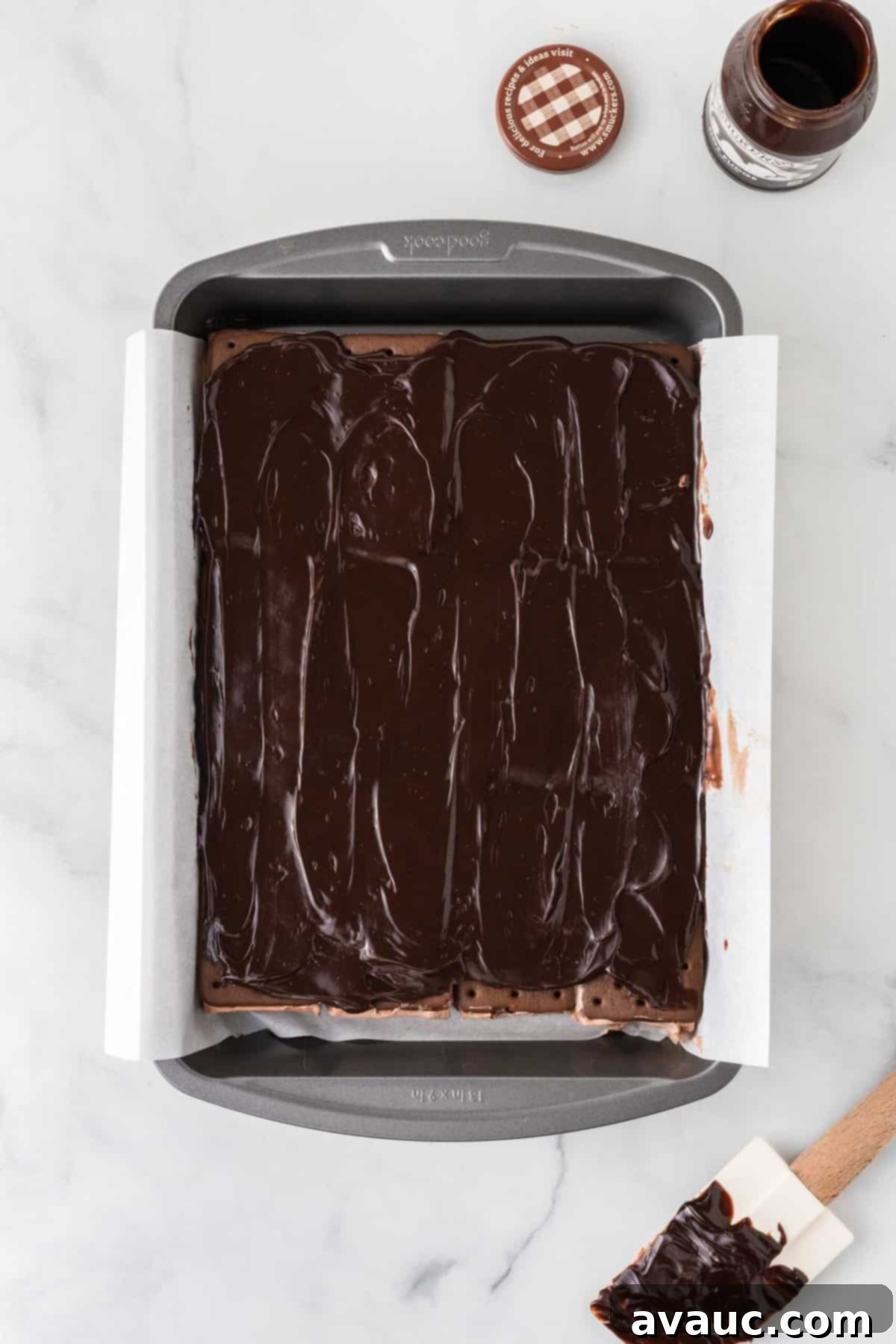 Dreamy Ice Cream Sandwich Cake 9 Overhead view of ice cream sandwich cake after adding and spreading the fudge layer