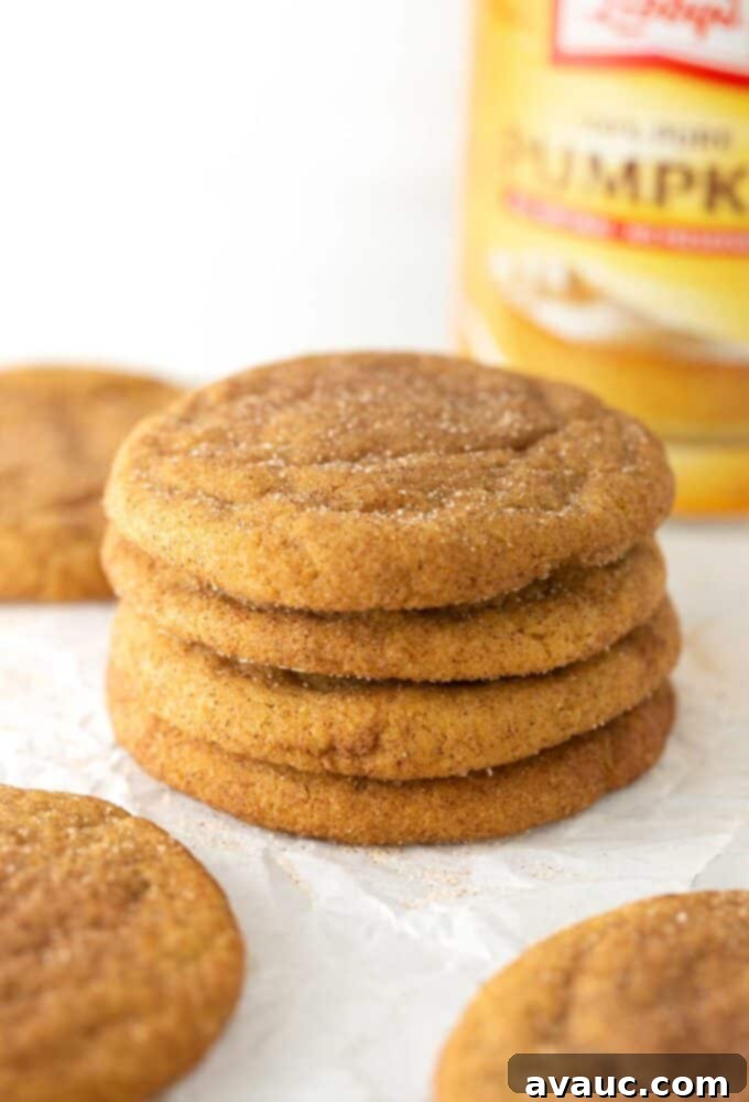 A perfectly arranged stack of soft and chewy pumpkin snickerdoodles, ready to be enjoyed.