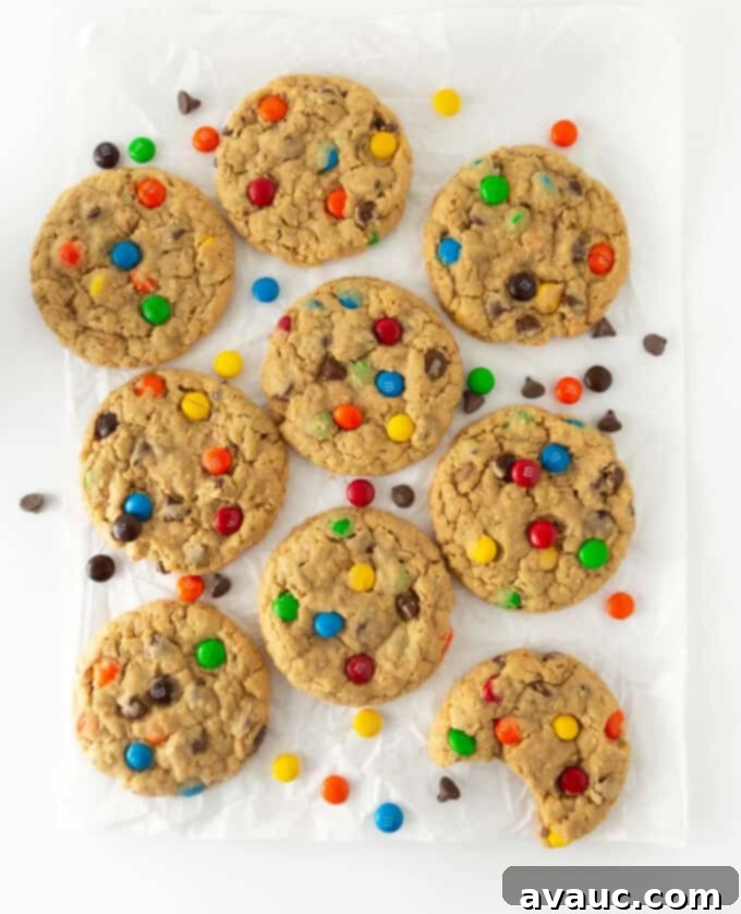 Stacked monster cookies on a plate, showcasing their inviting texture and colorful mix-ins