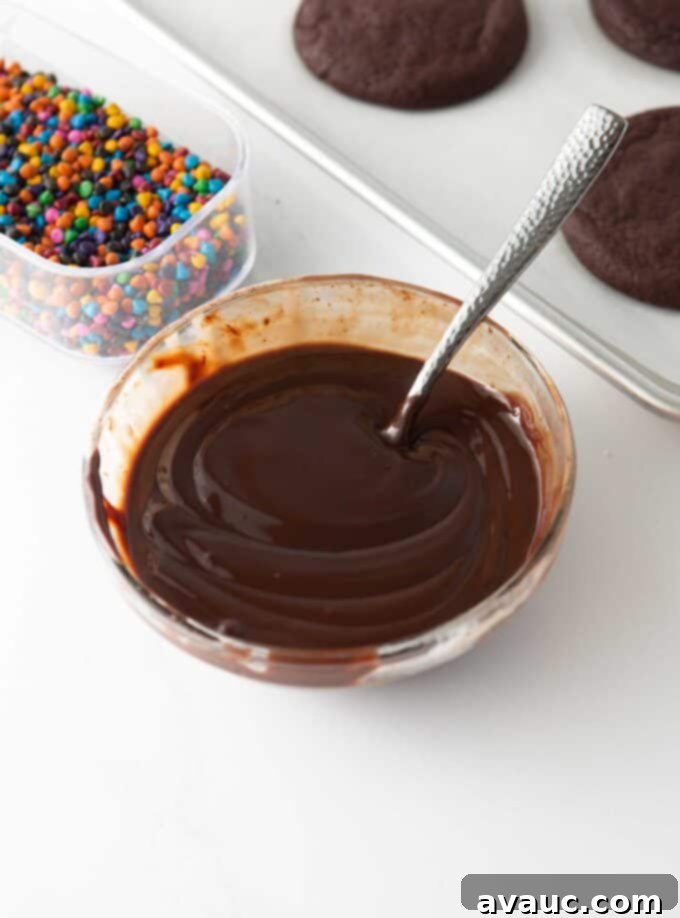 Fudgy Cosmic Brownie Cookies 9 chocolate ganache in glass bowl with fork