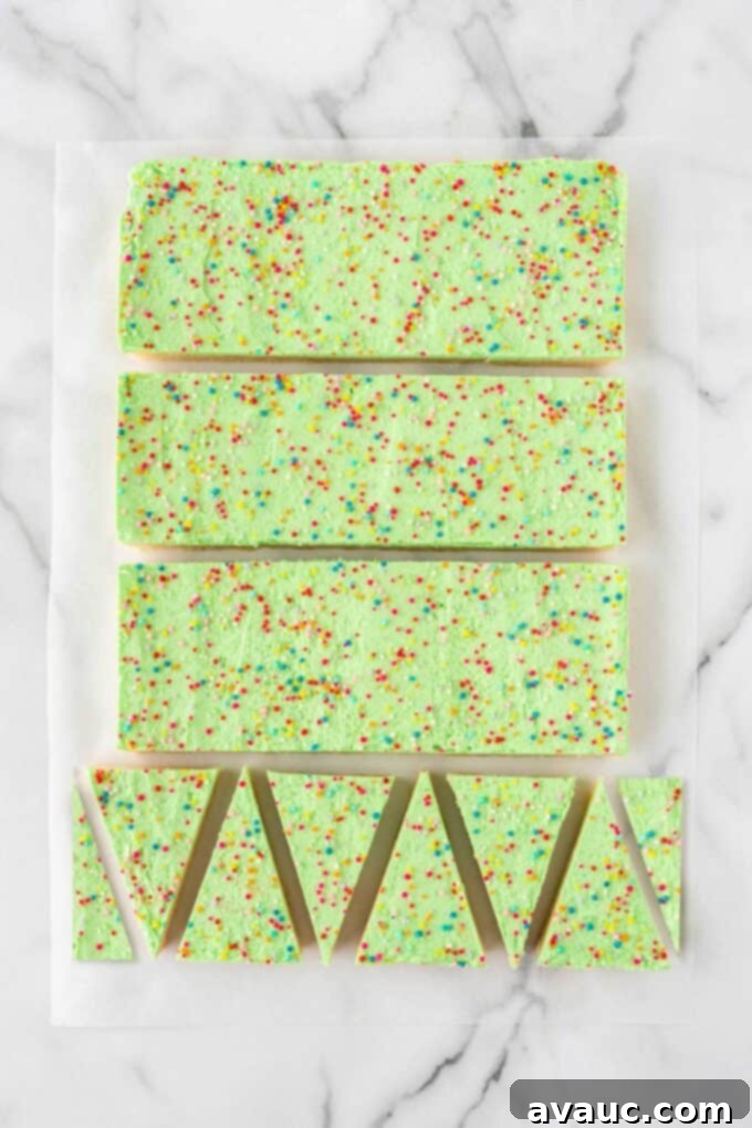 Festive Christmas Tree Sugar Cookie Bars 12 Step 3 of how to cut triangle Christmas trees out of a 9x13 pan of sugar cookie bars: cut each quadrant into 6 triangles.
