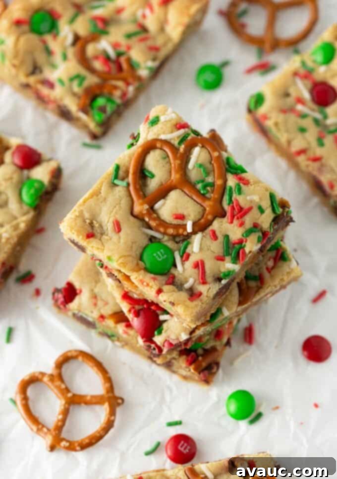 Festive Cookie Squares 2 Stack of festive red and green M&M Christmas cookie bars, showcasing their soft and chewy texture.