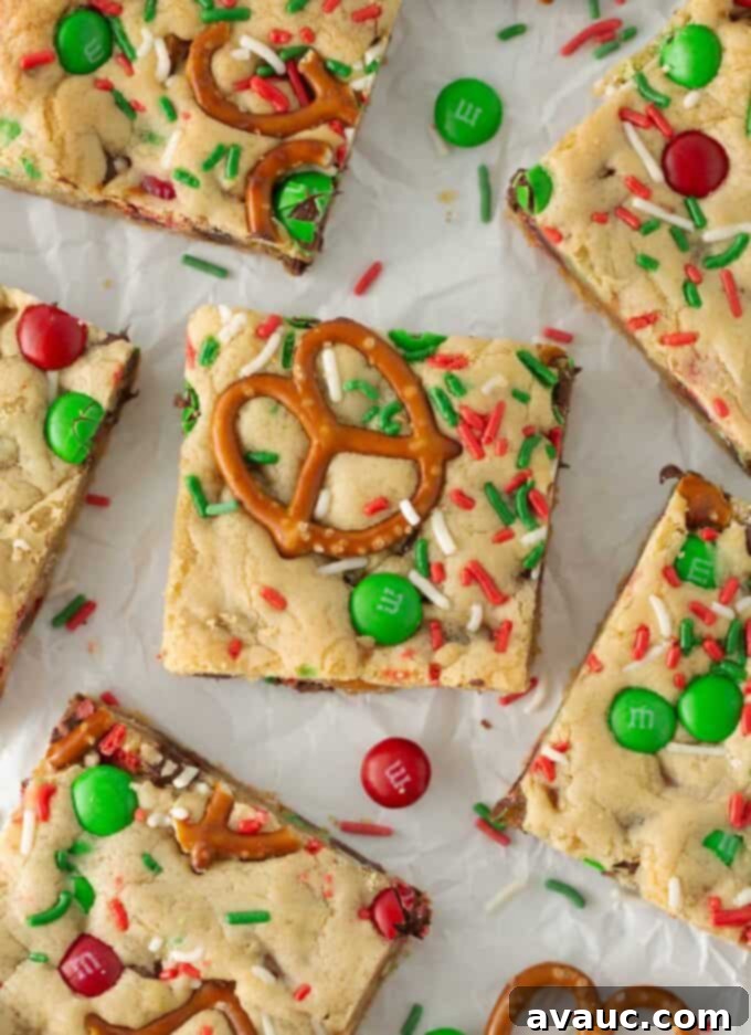 Festive Cookie Squares 11 Close-up of a delicious Christmas cookie bar, showing the rich texture and colorful mix-ins.