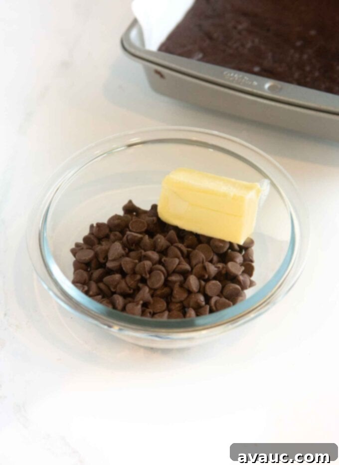 Decadent Thin Mint Cookie Bars 8 glass bowl with chocolate chips and half stick of butter