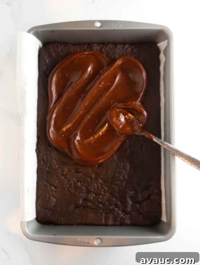 Decadent Thin Mint Cookie Bars 10 9x13 pan of chocolate thin mint cookie bars with chocolate coating spread on top
